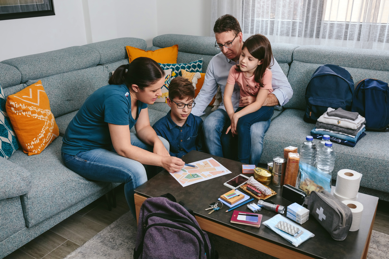 Family discussing evacuation plan routes for emergencies